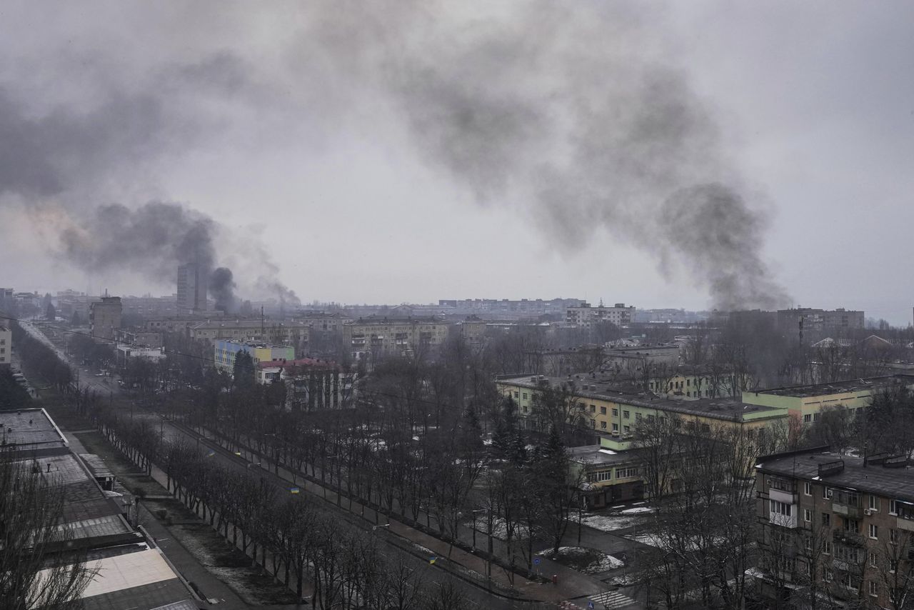 Smoke rises over Mariupol, where a Russian strike hit a maternity hospital