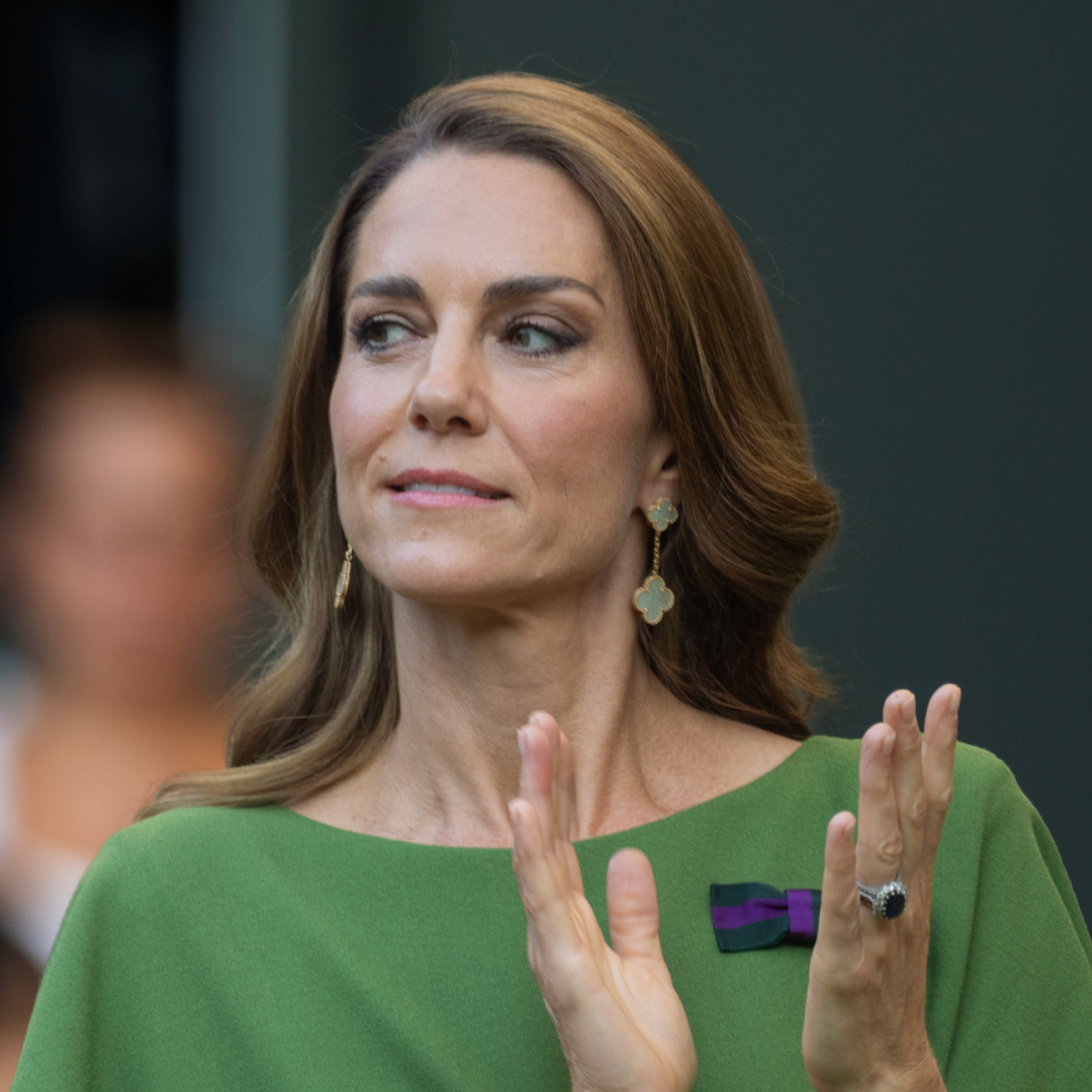 Princess Kate wears a green dress and has long brown hair with blonde highlights while applauding at Wimbledon 2026