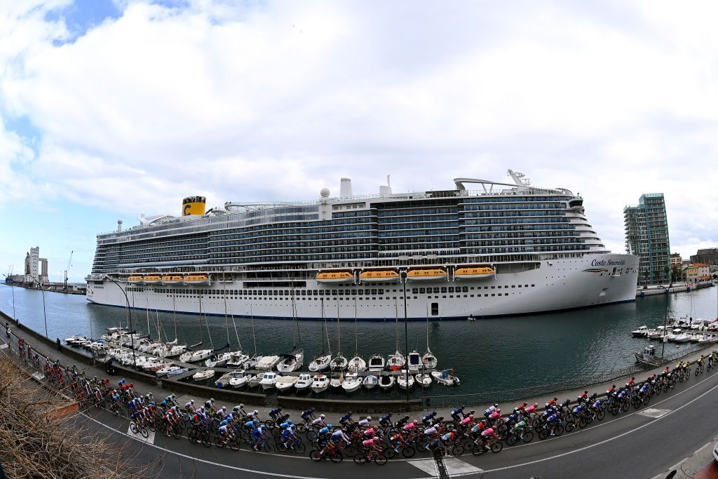 SANREMO ITALY MARCH 18 General view of the peloton as it passes through the harbour of Savona city during the 114th MilanoSanremo 2023 a 294km one day race from Abbiategrasso to Sanremo MilanoSanremo UCIWT on March 18 2023 in Sanremo Italy Photo by Tim de WaeleGetty Images