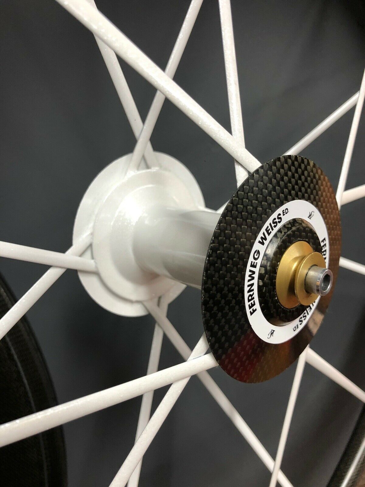 The white of the carbon spokes extends onto the hubs, making for very striking-looking wheels