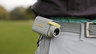 CaddyTalk Minion Rangefinder in case clipped on to belt