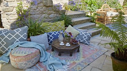 outdoor living with rugs and cushions made from recycled plastic bottles