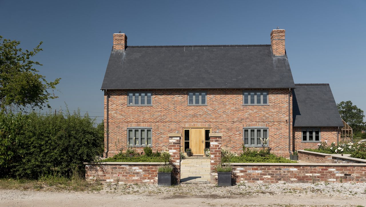 traditional brick house with formal front garden