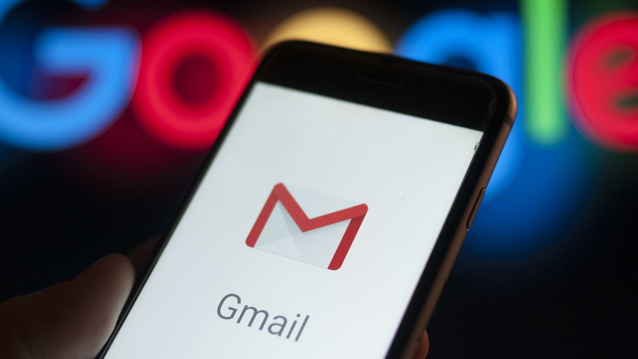 Gmail running on phone with Google logo in background