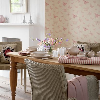 dining area with dining table chairs and tableware