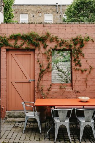 Small terrace with orange brick wall