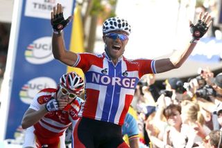 As Thor Hushovd (Norway) celebrates Matti Breschel (Denmark) can't believe how close he came.