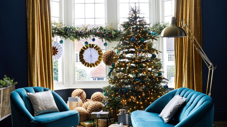 Christmas living room with blue velvet sofas