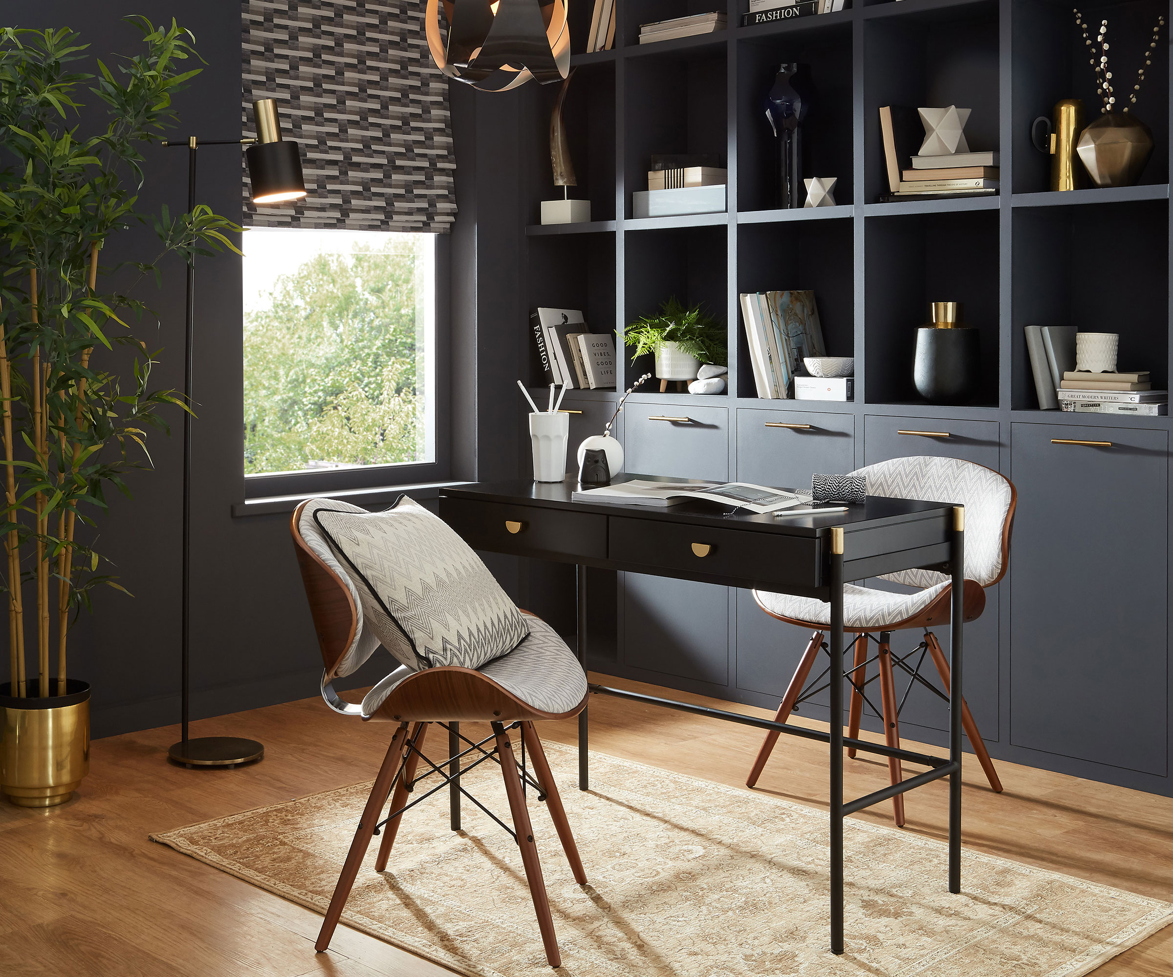blue home office with small desk and open shelving