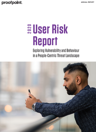 2020 user risk report - whitepaper from Proofpoint - a man on a balcony looking at his phone