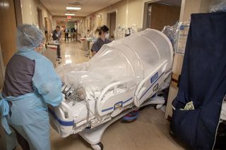 Hospital staff transport a patient in Holy Name Medical Center in Teaneck, New Jersey,