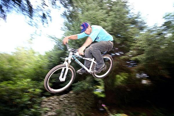 Gee Atherton catches air.
