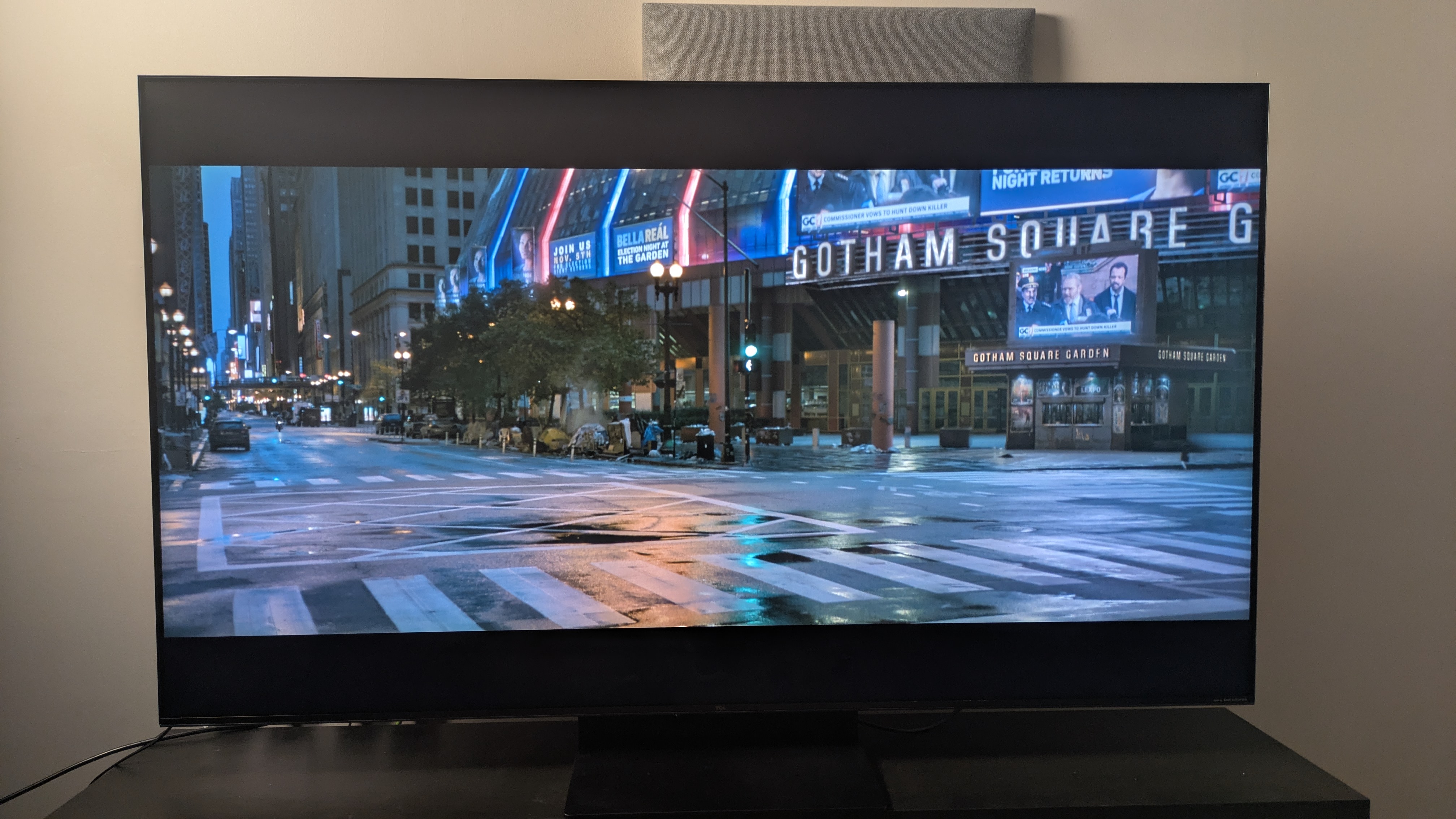 TCL C7K with shot of Gotham from The Batman on screen