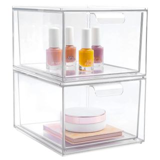 An acrylic see-through makeup organizer features two large drawers