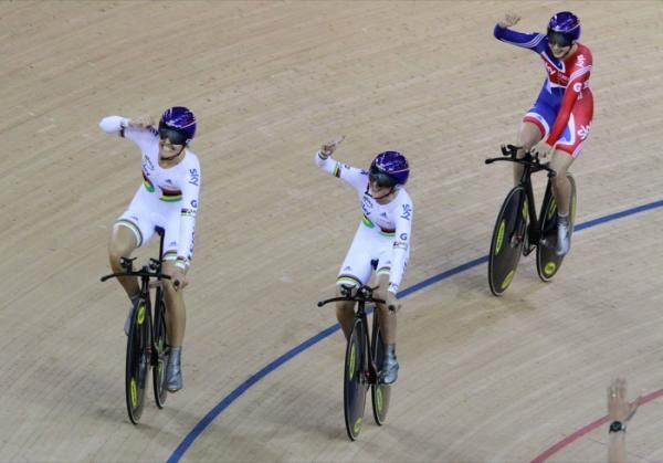 Great Britain's team pursuiters celebrate their gold medal and world record performance.