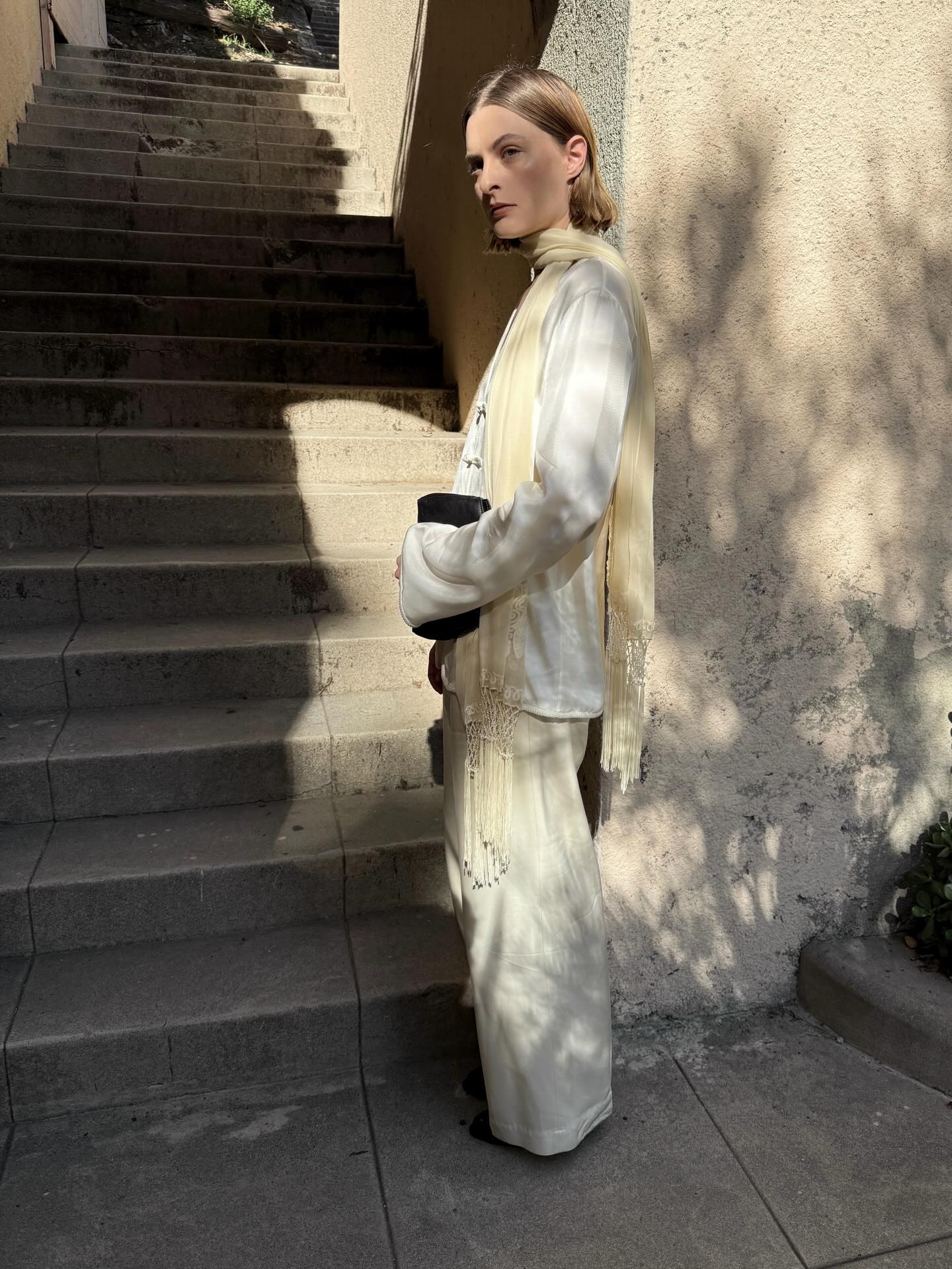 Christy Tyler posing for a photo wearing trousers