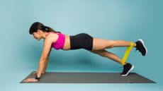 Woman doing a resistance band core workout