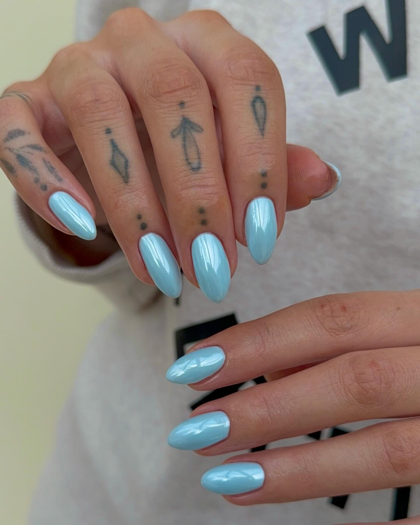A light blue glazed nails.