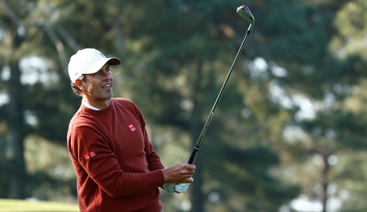 Scott watches his iron shot from off the tee