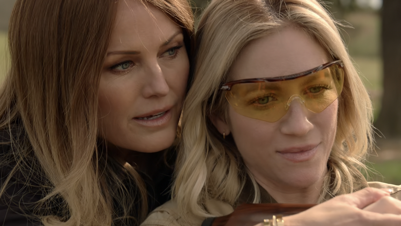 Margo Akerman&#039;s Margo teaches Brittany Snow how to shoot a rifle while behind her in The Hunting Wives