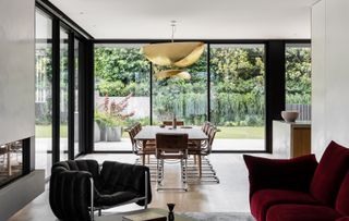 Dining area with floor to ceiling windows at Hideaway House, Melbourne, by Cera Stribley