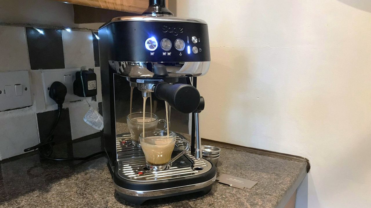 Breville Bambino Plus coffee maker on kitchen counter