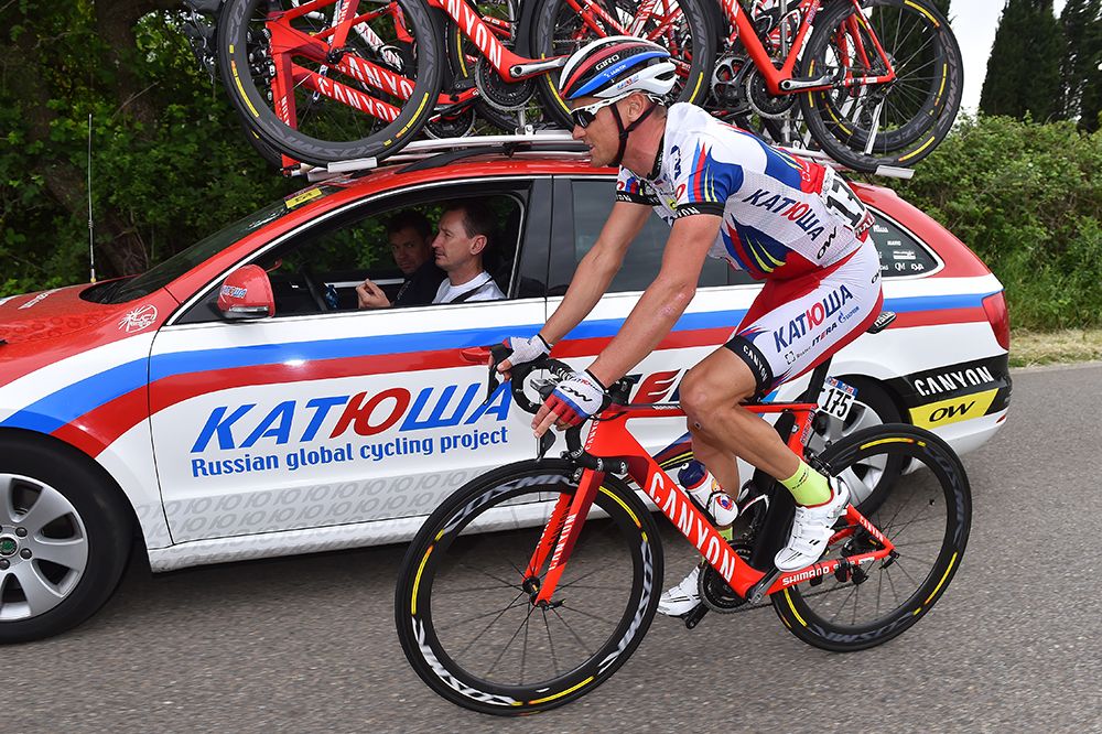 Sergei Lagutin rides along with the team car