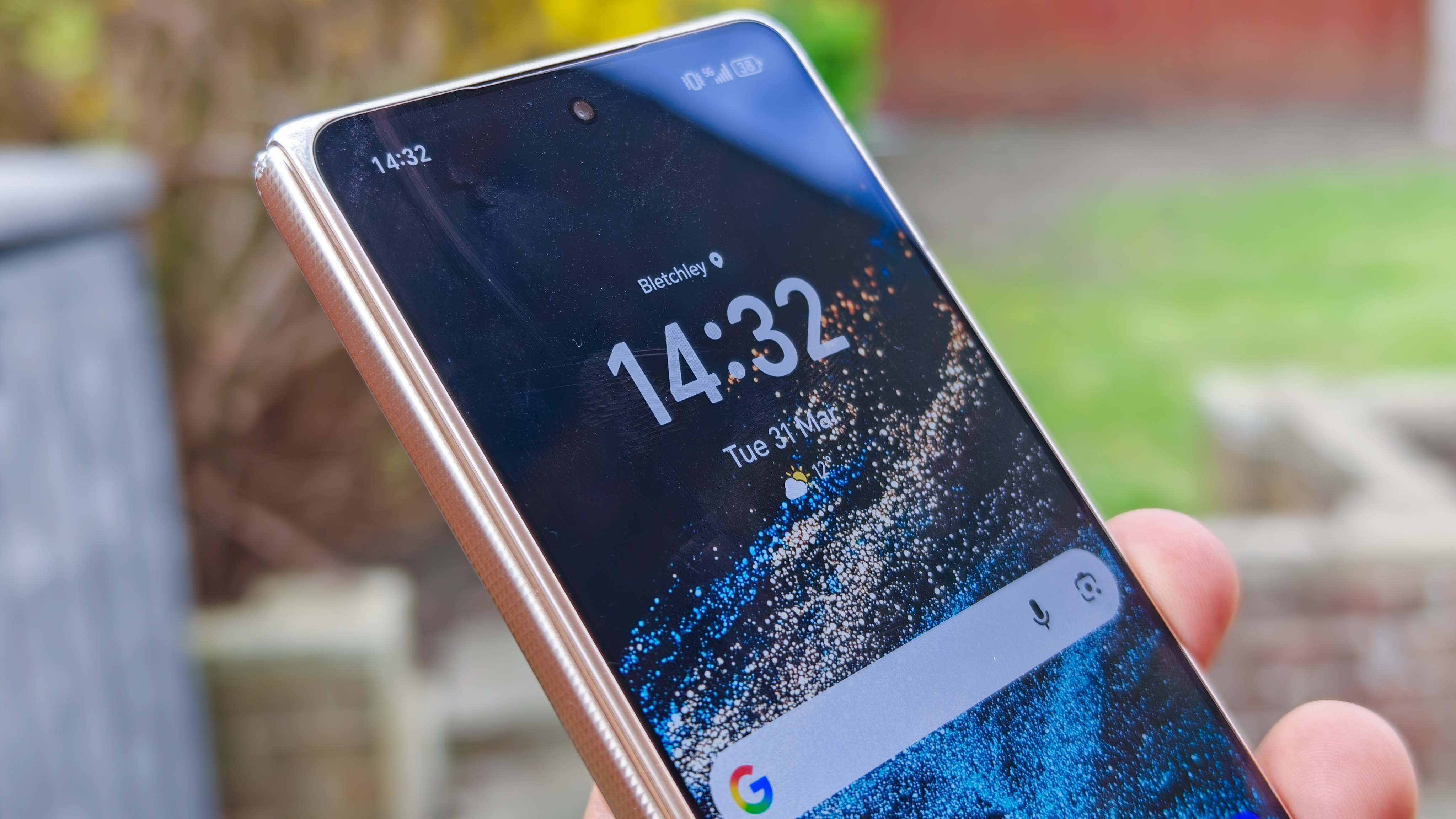 The Honor Magic V6 in gold after being put through a washing machine, complete with scratches and blemishes but fully working. 