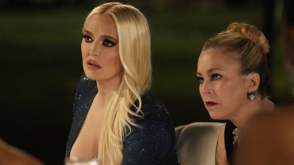 Erika and Sutton sitting next to each other outside in The Real Housewives of Beverly Hills season 12