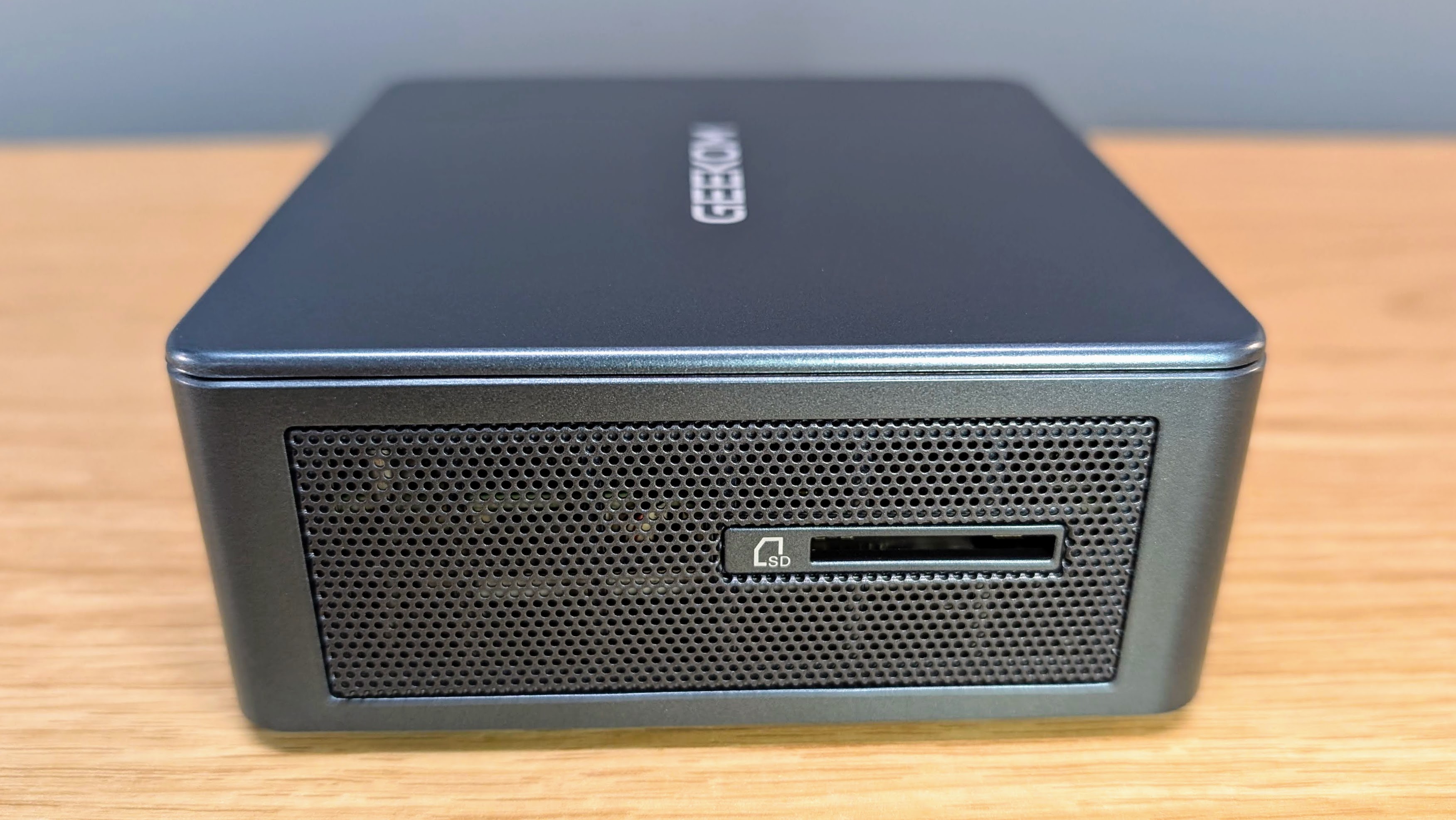 Geekom IT12 mini PC showing the SD card reader on the side