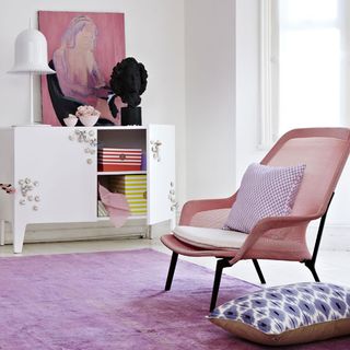 room white wall and pink chair