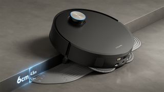 Dreame X50 Ultra Complete robot vacuum climbing a tall threshold