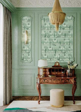 Panels have been wallpapered to create a cohesive look with the green painted walls