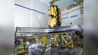 On Jan. 4, 2022, engineers successfully deployed the James Webb Space Telescope sunshield, shown here during its final deployment test on Earth in December 2020 at Northrop Grumman in Redondo Beach, California. The tennis court-sized sunshield will protect the telescope from heat.