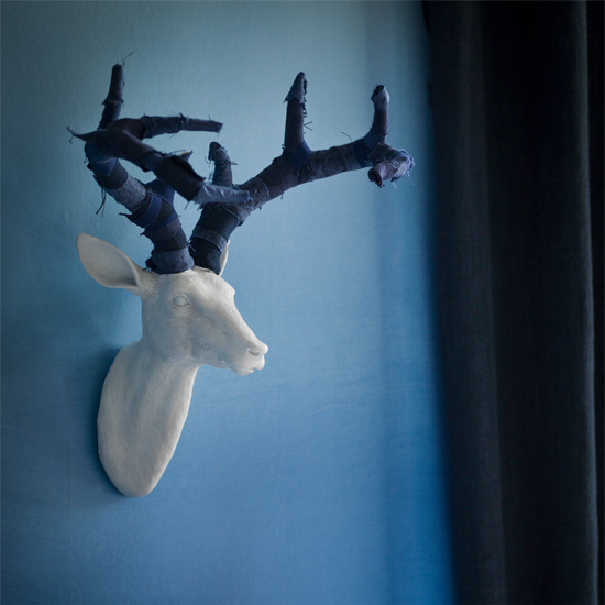 room with faux stags head