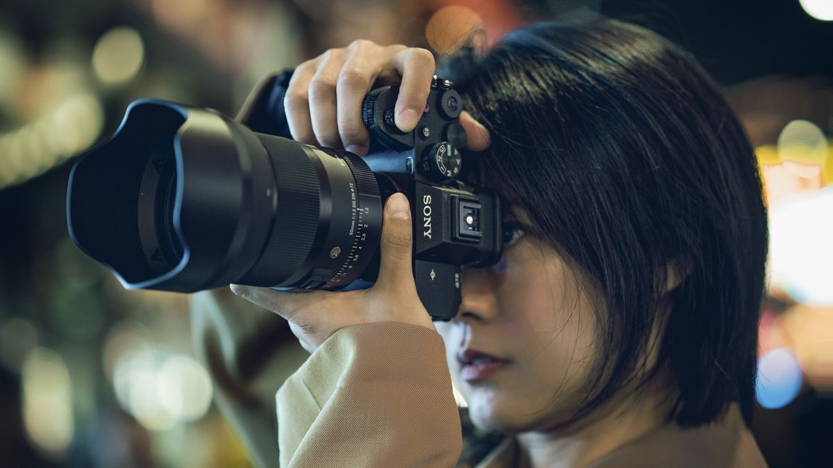 Sigma 50mm F1.2 DG DN Art lens in the hand