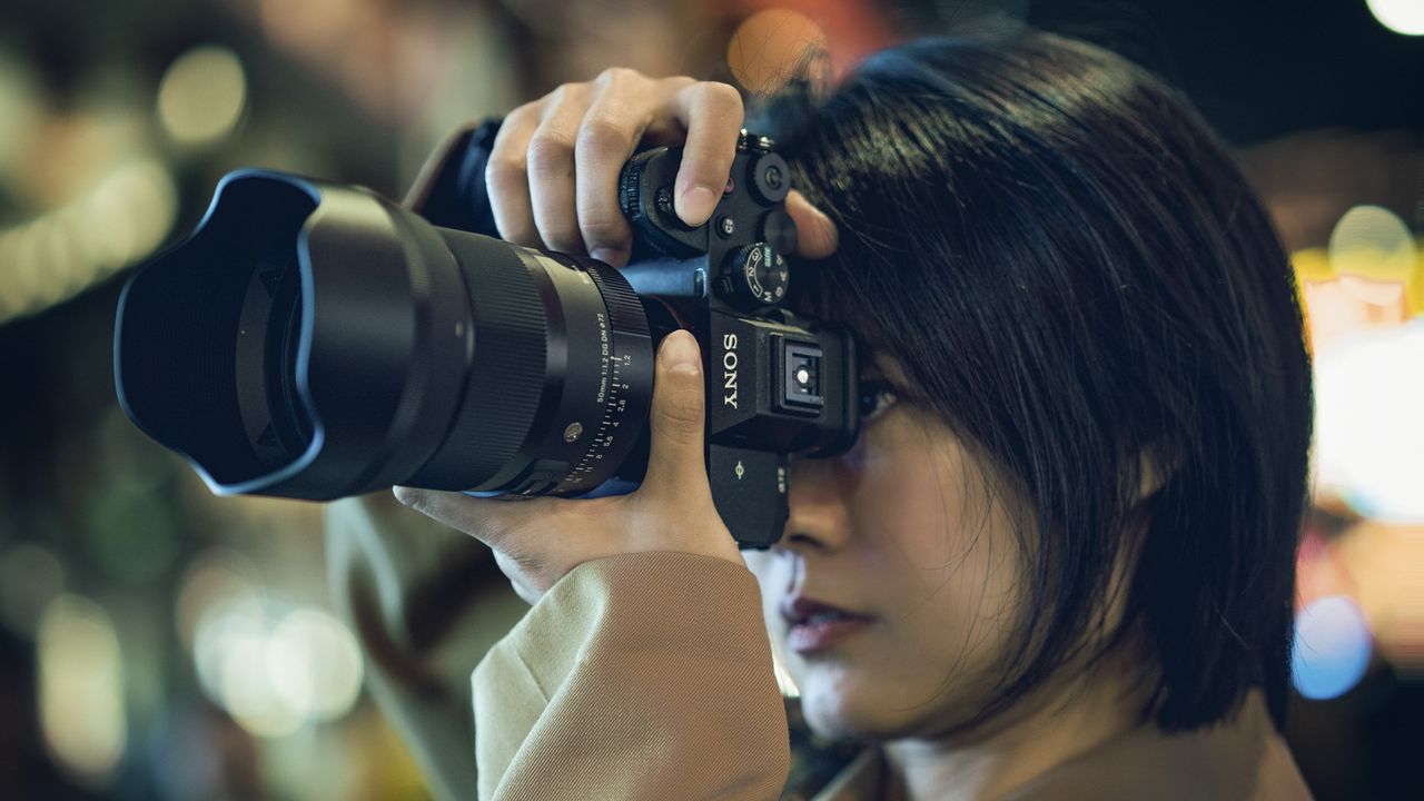 Sigma 50mm F1.2 DG DN Art lens in the hand