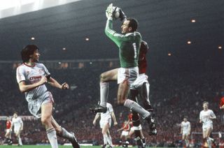 Liverpool goalkeeper Bruce Grobbelaar catches a ball in a game against Manchester United in 1987.