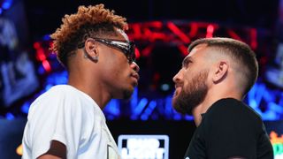  Devin Haney (L) and Vasiliy Lomachenko (R) face-off during the press conference prior to their May 20 Undisputed lightweight championship fight at MGM Grand Hotel & Casino on May 17, 2023 in Las Vegas