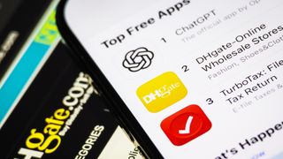 CHONGQING, CHINA - APRIL 15: In this photo illustration, the DHgate app is shown ranked second on the Top Free Apps chart in the Apple App Store, just below ChatGPT and above TurboTax, while part of the DHgate website interface is visible in the background, on April 15, 2025 in Chongqing, China. The Trump trade war has gone viral on TikTok, pushing a Chinese e-commerce app, DHgate, to the No. 2 spot on the US App Store's free iPhone apps chart. (Photo by Cheng Xin/Getty Images)