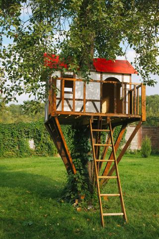 treehouse ideas: small house with red roof