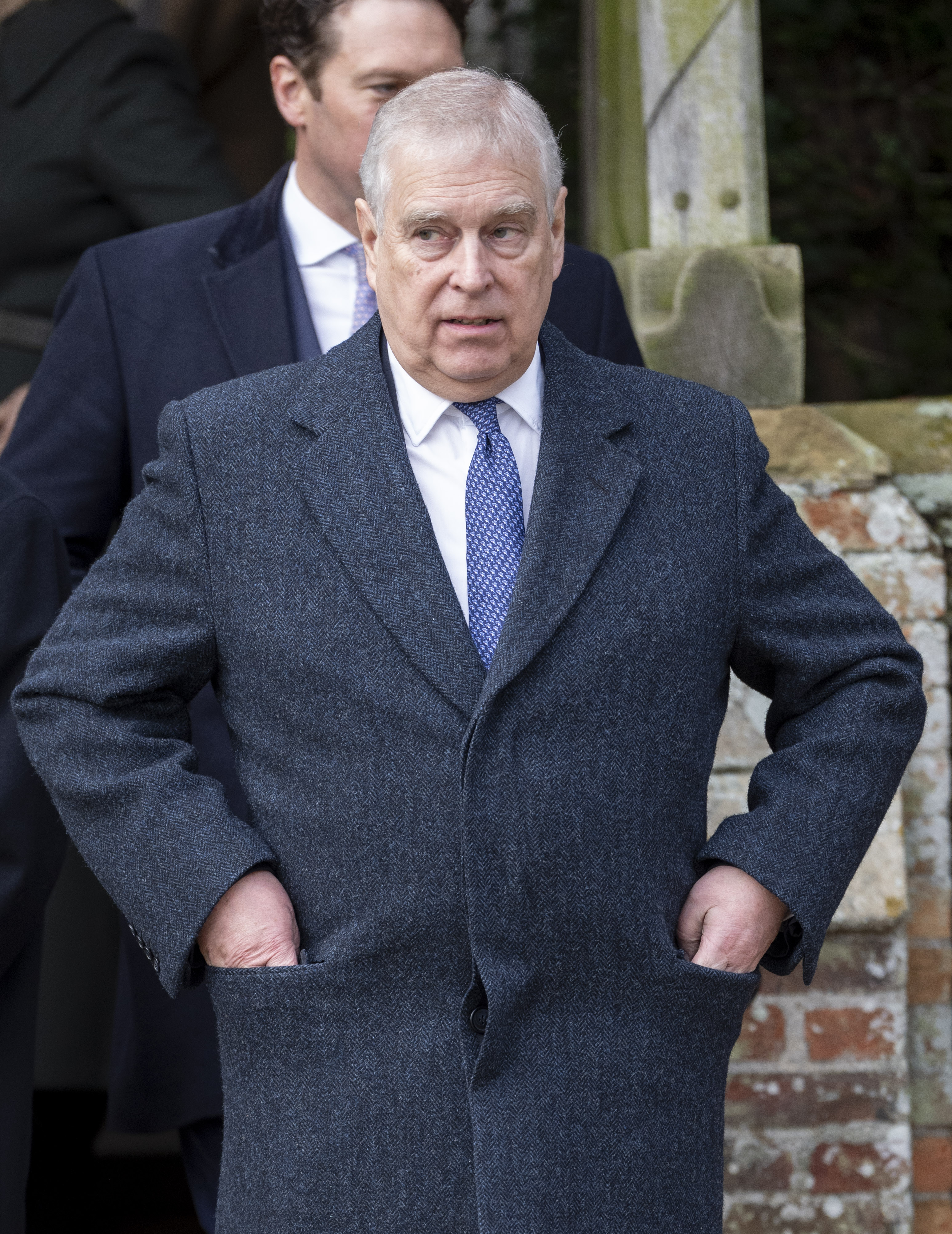 Prince Andrew wearing a gray coat