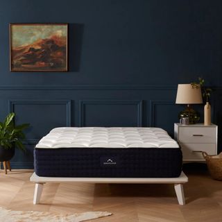 DreamCloud Luxury Hybrid Mattress on a bed.