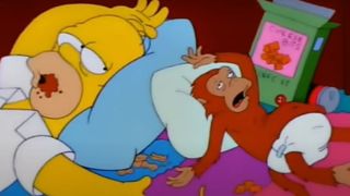 Homer and his helper monkey, Mojo, struggling for life on The Simpsons