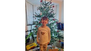 Boy with presents at Christmas