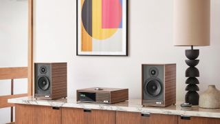 Ruark Audio R610 with Sabre-R speakers on a marble and wood shelf