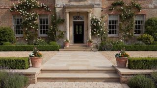 large country home with paved and cobble sett pathway and steps