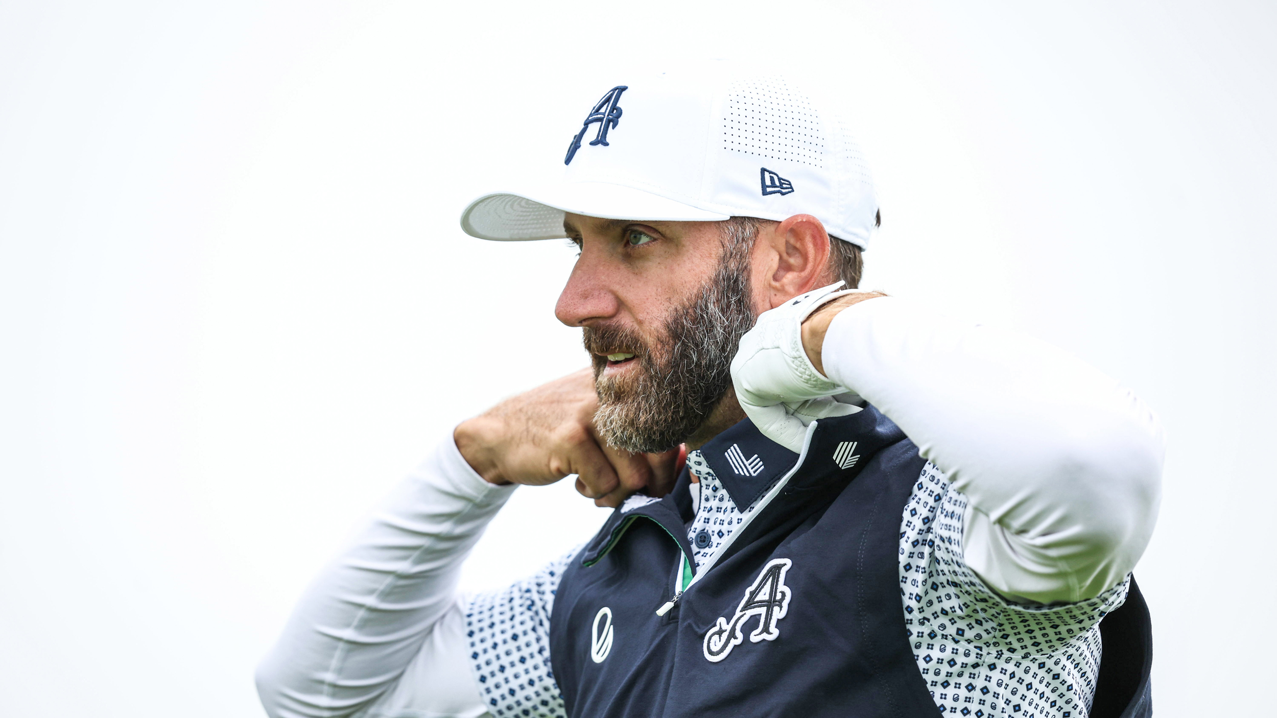 Dustin Johnson sorts out his collar during the 2025 Alfred Dunhill Links Championship