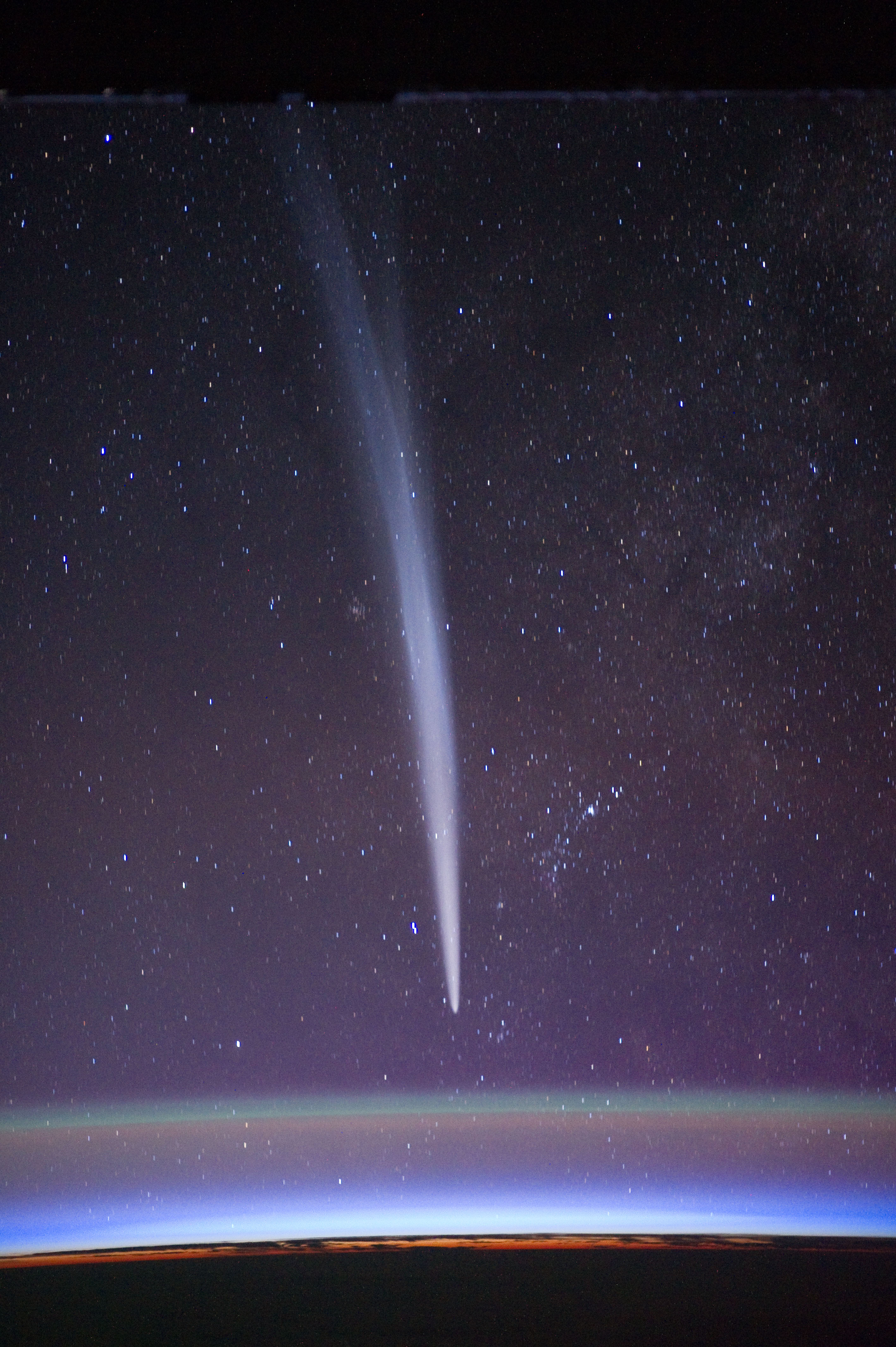 Comet Lovejoy is visible near Earth&#039;s horizon in this nighttime image photographed by NASA astronaut Dan Burbank, Expedition 30 commander, onboard the International Space Station on Dec. 22, 2011. 