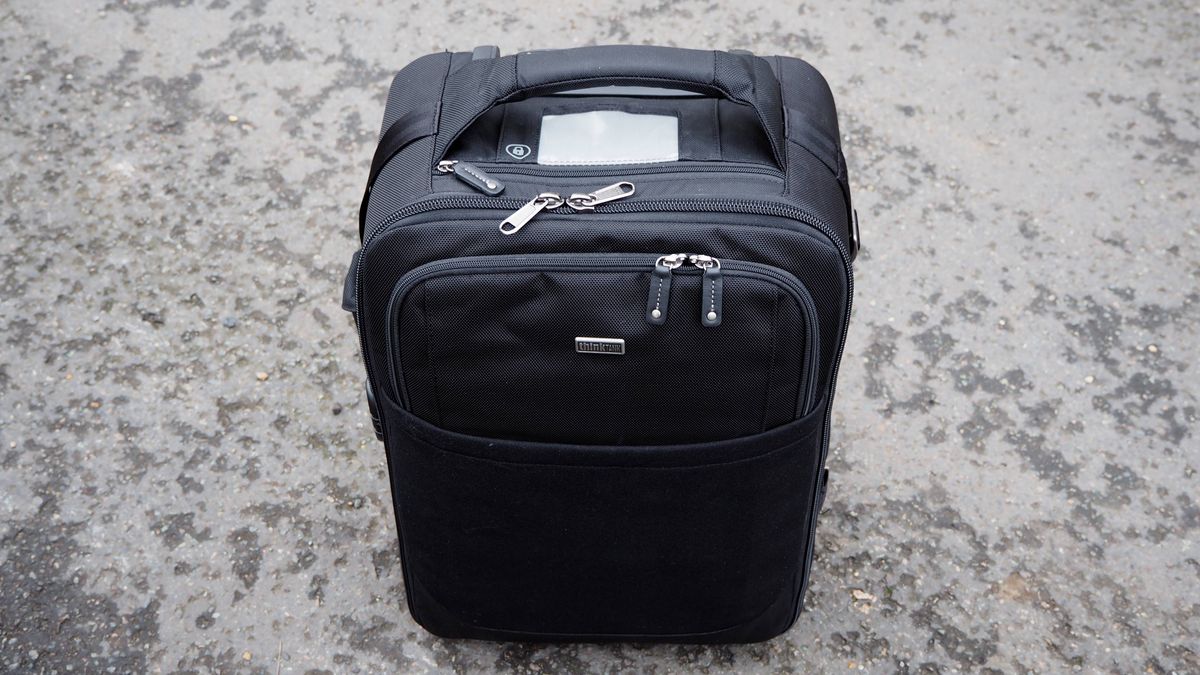 Think Tank Airport International V3.0 travel case on a stone floor